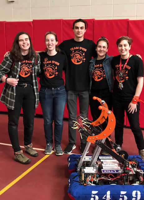 Annabelle with FRC team seniors and robot